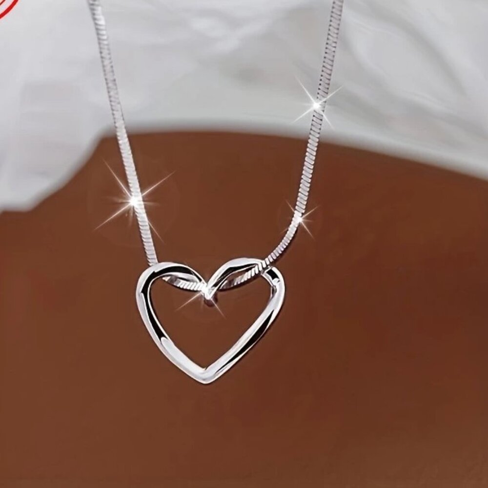 1pc.  Silver-toned Hollowed-out Heart Necklace